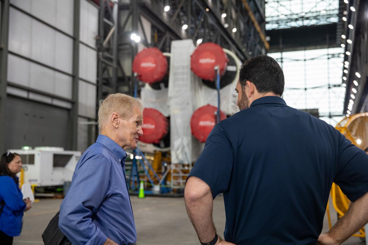 NASA Administrator Bill Nelson and NASA Exploration Ground Systems Program Deputy Manager Jeremy Parsons visit the agency’s SLS (Space Launch System) rocket core stage for the Artemis II mission inside NASA’s Kennedy Space Center in Florida on Thursday, Aug. 29, 2024. In the coming months, teams will integrate the rocket core stage atop the mobile launcher with the additional Artemis II flight hardware, including the twin solid rocket boosters, launch vehicle stage adapter, and the Orion spacecraft.