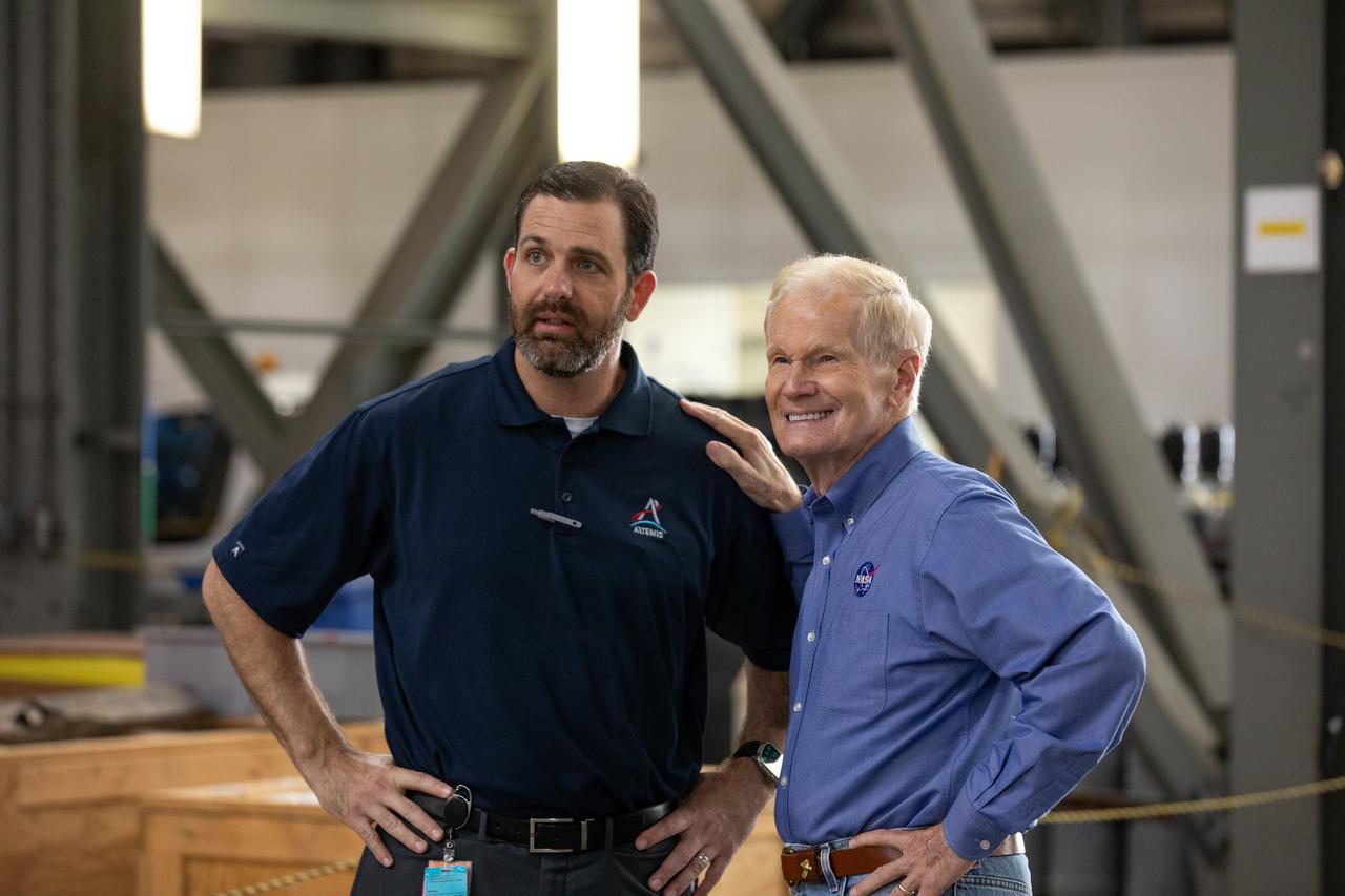 NASA Administrator Bill Nelson and NASA Exploration Ground Systems Program Deputy Manager Jeremy Parsons visit the agency’s SLS (Space Launch System) rocket core stage for the Artemis II mission inside NASA’s Kennedy Space Center in Florida on Thursday, Aug. 29, 2024. In the coming months, teams will integrate the rocket core stage atop the mobile launcher with the additional Artemis II flight hardware, including the twin solid rocket boosters, launch vehicle stage adapter, and the Orion spacecraft.
