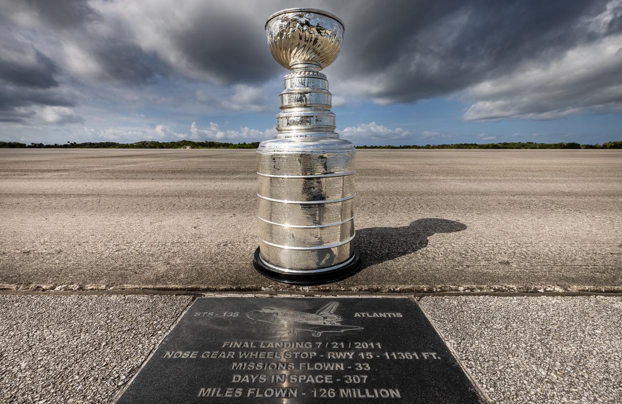 Earlier this year, the Florida Panthers won their first NHL championship and brought victory to the state of Florida. As part of its championship tour, the Stanley Cup made a visit to Kennedy Space Center. Pictured here is the Stanley Cup on the runway of the Launch and Landing Facility, formerly the Shuttle Landing Facility at NASA’s Kennedy Space Center on Tuesday Sept. 17, 2024. The trophy is beside the Space Shuttle Atlantis landmark, a commemorative plaque marking the landing spot of the last shuttle flight that occurred in July 2011.