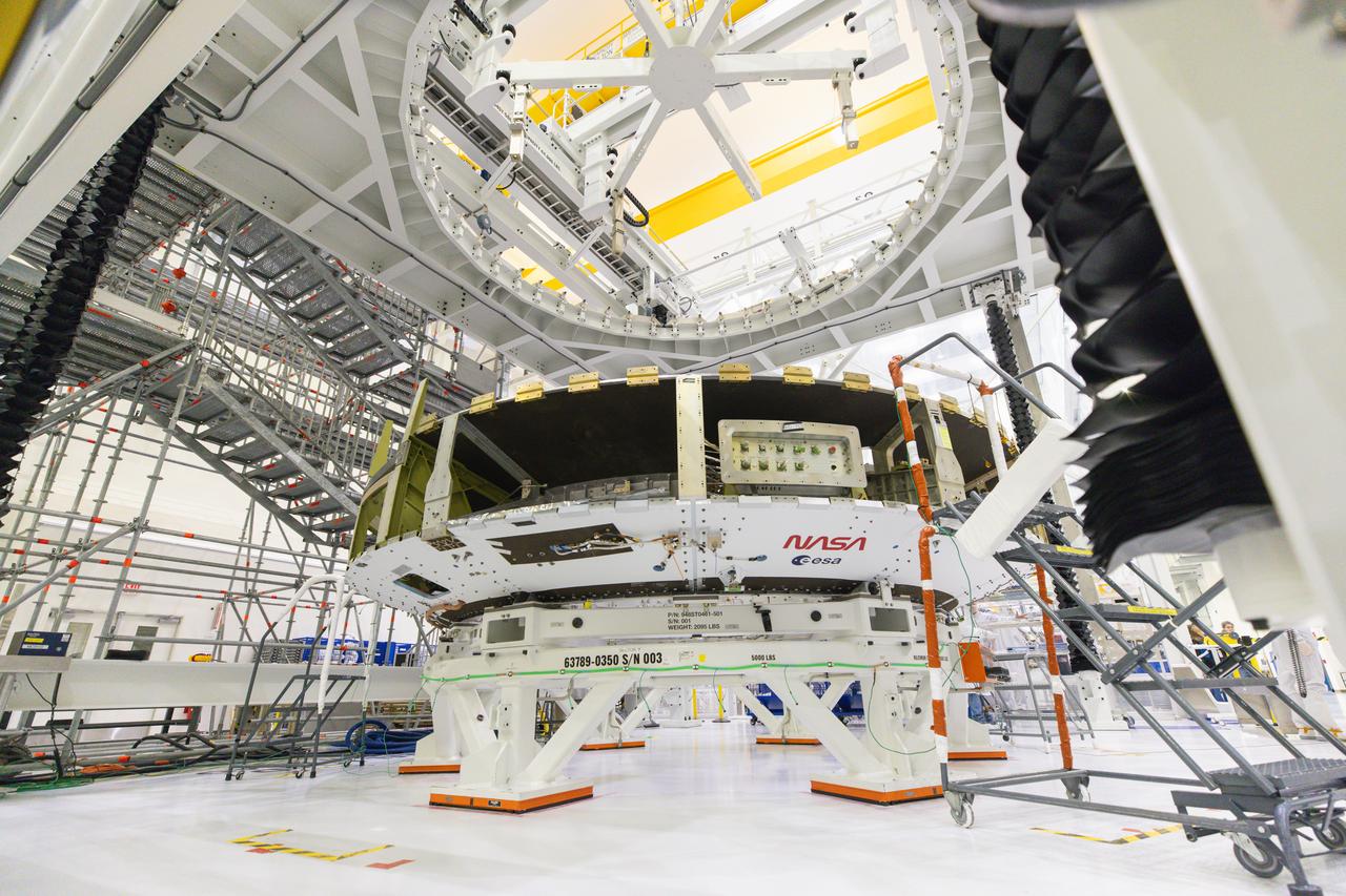 Teams from NASA, ESA (European Space Agency), and Airbus prepare to integrate European Service Module 3 to the crew module adapter on Tuesday, Sept. 17, 2024, inside the Neil A. Armstrong Operations and Checkout Building at NASA’s Kennedy Space Center in Florida. The integrated hardware provides propulsion, electrical power, and other important elements for the Orion spacecraft’s Artemis III campaign to the lunar South Pole region of the Moon. 