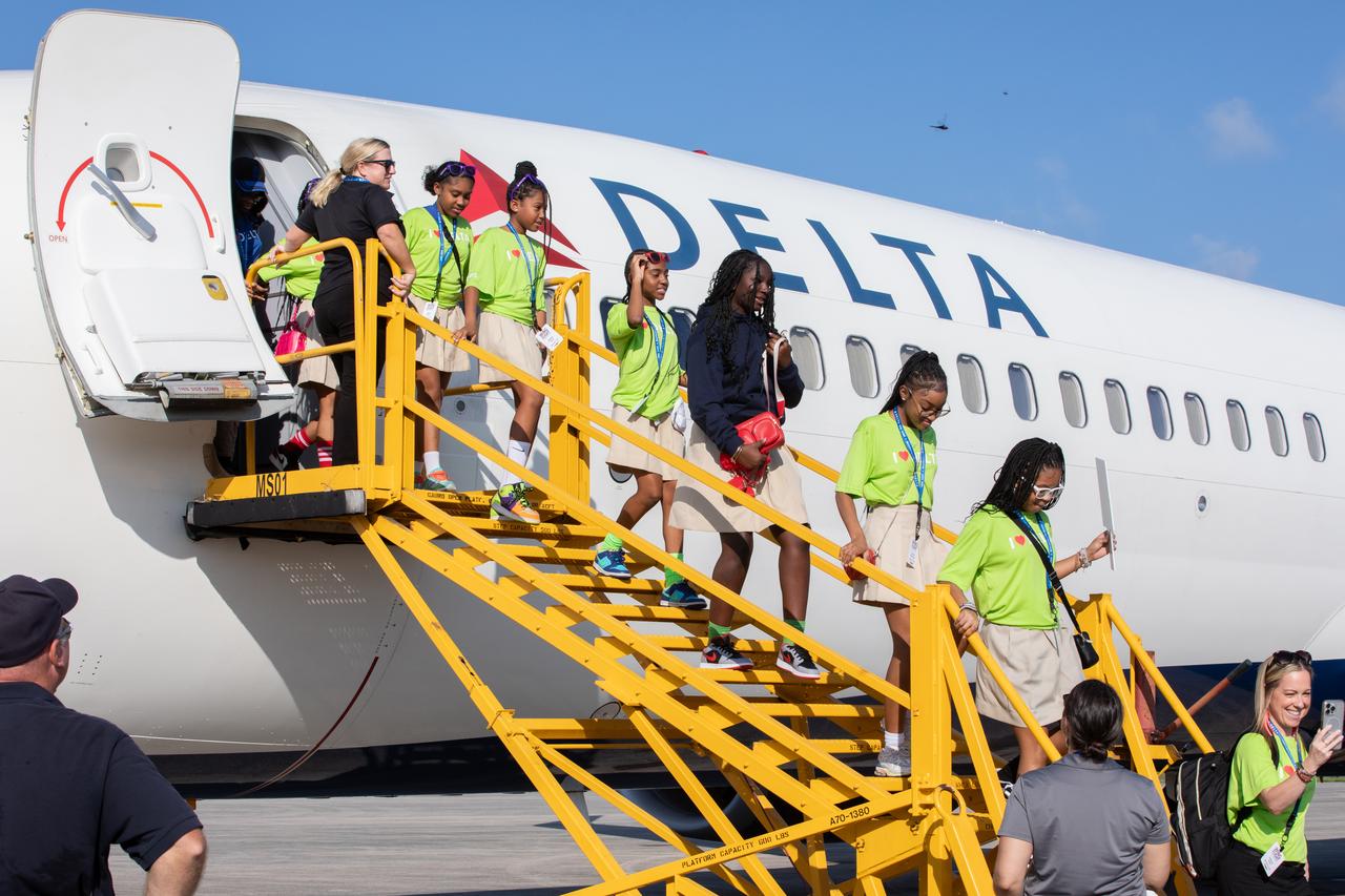 Roughly 130 young women with an interest in STEM (science, technology, engineering, and math) from Delta Air Lines’ Women Inspiring Our Next Generation (WING) flight arrive Friday, Sept. 20, 2024, at NASA’s Kennedy Space Center in Florida. The initiative between Delta and NASA Kennedy showcases the various STEM careers available at the Florida spaceport. The group had the opportunity to view center facilities and hear from a panel of women about their careers at Kennedy and Delta. 