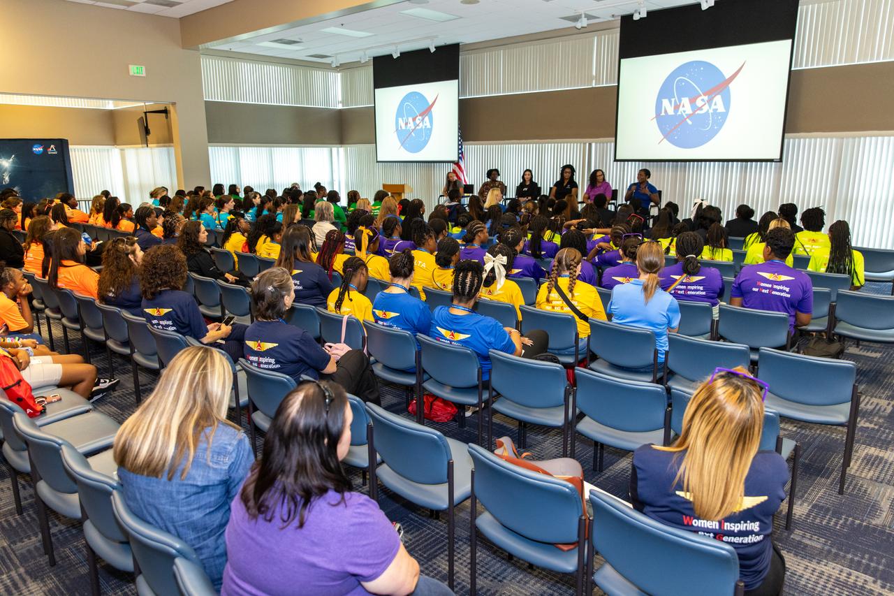 Young women, ages 11 to 18, from the Atlanta, Georgia area, with interests in STEM (science, technology, engineering, and math), pose for a photo on Friday, Sept. 20, 2024, at NASA’s Kennedy Space Center in Florida. NASA Kennedy hosted the Delta Air Lines’ Women Inspiring Our Next Generation (WING) flight to showcase various women-led STEM careers available at the Florida spaceport.