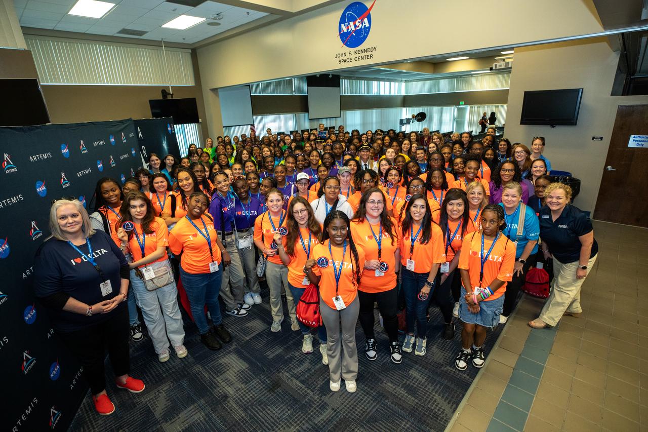 Young women, ages 11 to 18, from the Atlanta, Georgia area, with interests in STEM (science, technology, engineering, and math), pose for a photo on Friday, Sept. 20, 2024, at NASA’s Kennedy Space Center in Florida. NASA Kennedy hosted the Delta Air Lines’ Women Inspiring Our Next Generation (WING) flight to showcase various women-led STEM careers available at the Florida spaceport.