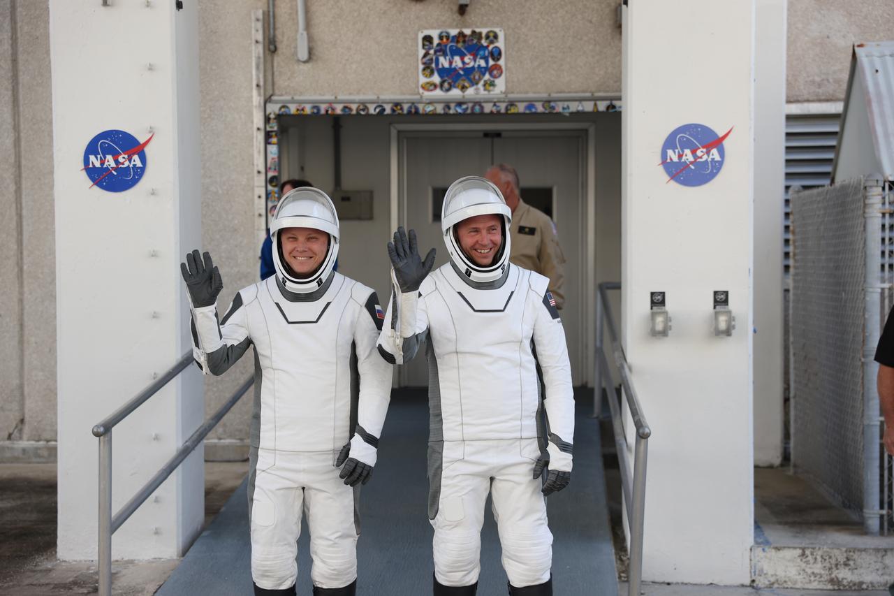 NASA’s SpaceX Crew-9 crew members, NASA astronaut Nick Hague (right) and Roscosmos cosmonaut Aleksandr Gorbunov, pose for a photo after walking out of the Neil A. Armstrong Operations and Checkout Building at the agency’s Kennedy Space Center in Florida during a countdown dress rehearsal on Tuesday, Sept. 24, 2024, to prepare for the upcoming Crew-9 launch. Hague and Gorbunov will launch to the International Space Station aboard SpaceX’s Dragon spacecraft and Falcon 9 rocket. Launch is targeted for 1:17 p.m. EDT Saturday, Sept. 28, 2024, from Space Launch Complex-40 at Cape Canaveral Space Force Station in Florida. Crew-9 is the ninth crew rotation mission with SpaceX to the space station as part of the agency’s Commercial Crew Program. 