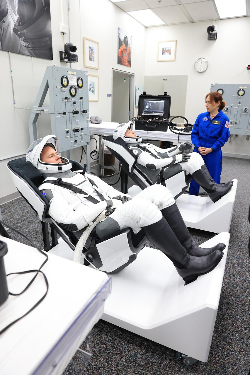 NASA’s SpaceX Crew-9 crew members are seated inside the crew suit-up room in the Neil A. Armstrong Operations and Checkout Building at the agency’s Kennedy Space Center in Florida during a countdown dress rehearsal on Tuesday, Sept. 24, 2024. Seated from left are NASA astronaut Nick Hague and Roscosmos cosmonaut Aleksandr Gorbunov. Hague and Gorbunov will launch to the International Space Station aboard SpaceX’s Dragon spacecraft and Falcon 9 rocket. Launch is targeted for 1:17 p.m. EDT Saturday, Sept. 28, 2024, from Space Launch Complex-40 at Cape Canaveral Space Force Station in Florida. Crew-9 is the ninth crew rotation mission with SpaceX to the space station as part of the agency’s Commercial Crew Program. 