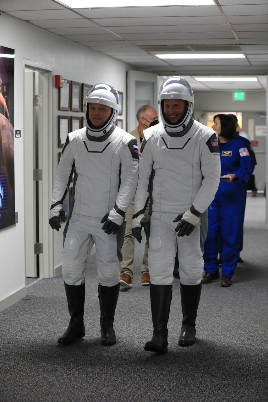 NASA’s SpaceX Crew-9 crew members, NASA astronaut Nick Hague (right) and Roscosmos cosmonaut Aleksandr Gorbunov, walk out of the Neil A. Armstrong Operations and Checkout Building at the agency’s Kennedy Space Center in Florida during a countdown dress rehearsal on Tuesday, Sept. 24, 2024, to prepare for the upcoming Crew-9 launch. Hague and Gorbunov will launch to the International Space Station aboard SpaceX’s Dragon spacecraft and Falcon 9 rocket. Launch is targeted for 1:17 p.m. EDT Saturday, Sept. 28, 2024, from Space Launch Complex-40 at Cape Canaveral Space Force Station in Florida. Crew-9 is the ninth crew rotation mission with SpaceX to the space station as part of the agency’s Commercial Crew Program. 
