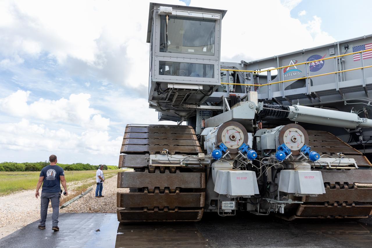 NASA’s crawler-transporter 2 moves slowly along the crawlerway towards Launch Pad 39B at the agency’s Kennedy Space Center in Florida on Wednesday, Sept. 25, 2024, after reaching the milestone of 2,500 miles traveled since its construction in 1965. Crawler-transporter 2 reached the milestone while teams with NASA’s Exploration Ground Systems took it on a trip in preparation for supporting the roll of the mobile launcher back into the spaceport’s Vehicle Assembly Building ahead of the Artemis II launch. Built originally to transport massive Saturn V rockets during the Apollo Program, crawler-transporter 2 continued its service during the Space Shuttle Program, and currently transports the massive SLS (Space Launch System) rocket and Orion spacecraft atop the mobile launcher as part of the agency’s Artemis campaign.