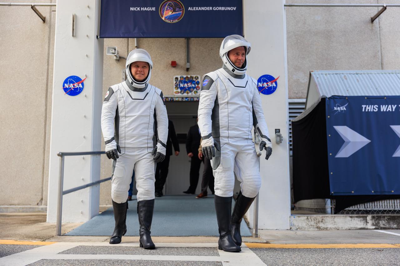 NASA’s SpaceX Crew-9 crew members walk out of the Neil A. Armstrong Operations and Checkout Building at the agency’s Kennedy Space Center in Florida ahead of launch on Saturday, Sept. 28, 2024. NASA astronaut Nick Hague (right) and Roscosmos cosmonaut Aleksandr Gorbunov will launch to the International Space Station aboard SpaceX’s Dragon spacecraft and Falcon 9 rocket. Launch is targeted for 1:17 p.m. EDT from Space Launch Complex-40 at Cape Canaveral Space Force Station in Florida. Crew-9 is the ninth crew rotation mission with SpaceX to the space station as part of the agency’s Commercial Crew Program.