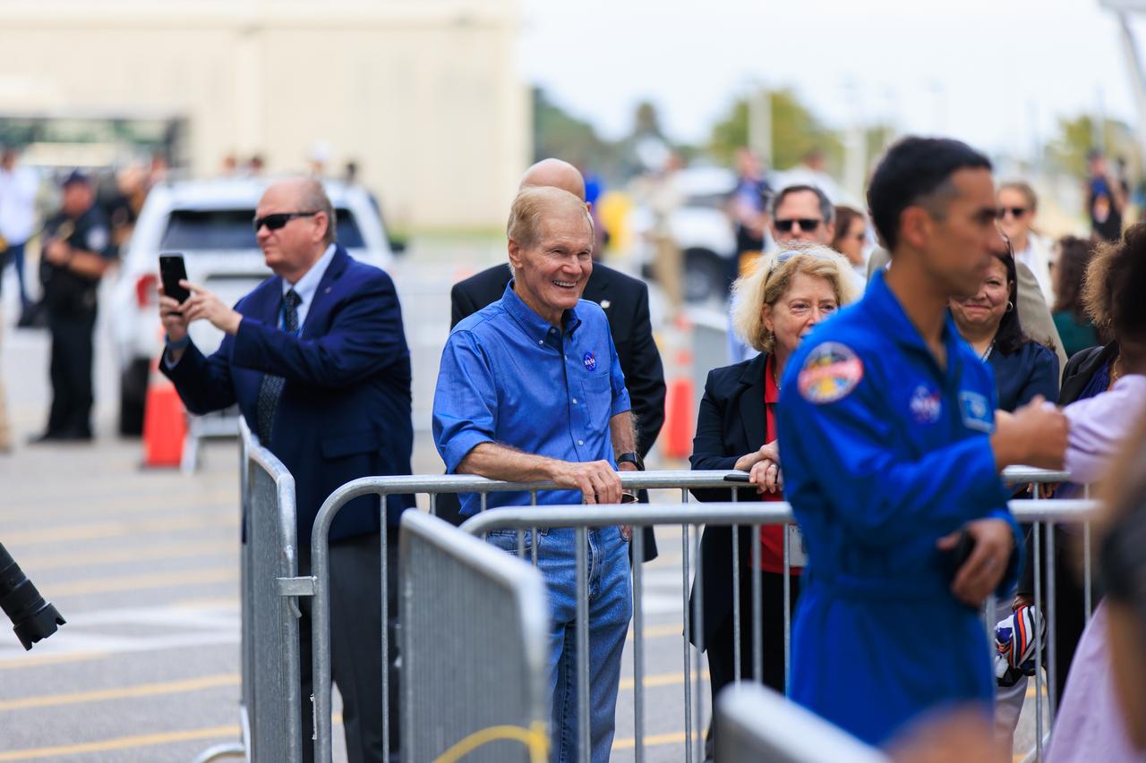 NASA Administrator Bill Nelson greets NASA’s SpaceX Crew-9 crew members as they walk out of the Neil A. Armstrong Operations and Checkout Building at the agency’s Kennedy Space Center in Florida ahead of launch on Saturday, Sept. 28, 2024. NASA astronaut Nick Hague and Roscosmos cosmonaut Aleksandr Gorbunov will launch to the International Space Station aboard SpaceX’s Dragon spacecraft and Falcon 9 rocket. Launch is targeted for 1:17 p.m. EDT from Space Launch Complex-40 at Cape Canaveral Space Force Station in Florida. Crew-9 is the ninth crew rotation mission with SpaceX to the space station as part of the agency’s Commercial Crew Program.