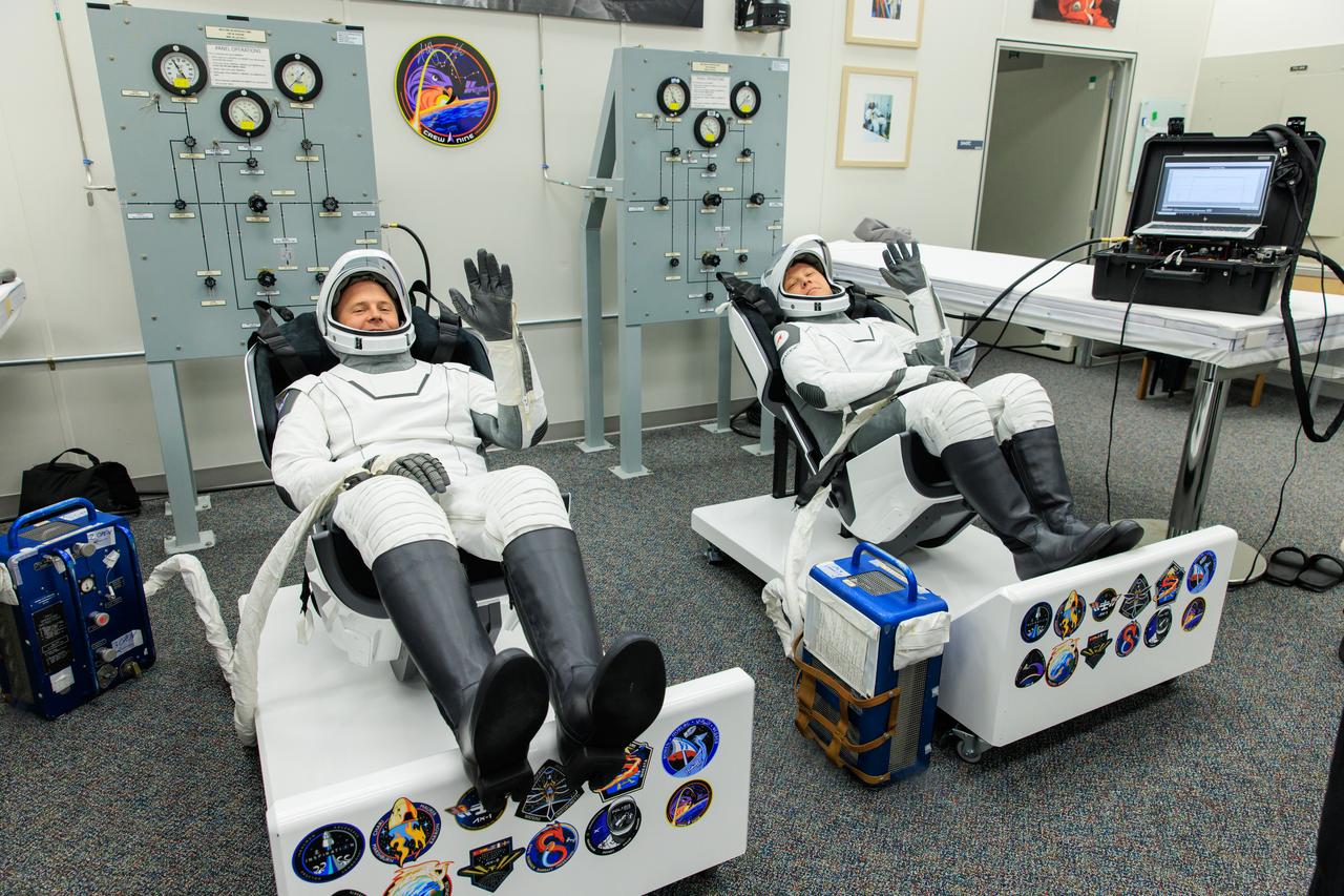 NASA’s SpaceX Crew-9 crew members are seated inside the crew suit-up room in the Neil A. Armstrong Operations and Checkout Building at the agency’s Kennedy Space Center in Florida ahead of launch to the International Space Station on Saturday, Sept. 28, 2024. NASA astronaut Nick Hague (left) and Roscosmos cosmonaut Aleksandr Gorbunov are scheduled to lift off aboard SpaceX’s Dragon spacecraft and Falcon 9 rocket at 1:17 p.m. EDT from Space Launch Complex-40 at Cape Canaveral Space Force Station in Florida. Crew-9 is the ninth crew rotation mission with SpaceX to the space station as part of the agency’s Commercial Crew Program. 
