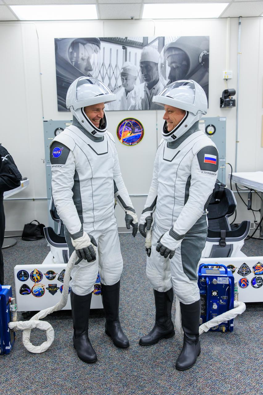 NASA’s SpaceX Crew-9 crew members check their SpaceX spacesuit inside the crew suit-up room in the Neil A. Armstrong Operations and Checkout Building at the agency’s Kennedy Space Center in Florida ahead of launch to the International Space Station on Saturday, Sept. 28, 2024. NASA astronaut Nick Hague (left) and Roscosmos cosmonaut Aleksandr Gorbunov are scheduled to lift off aboard SpaceX’s Dragon spacecraft and Falcon 9 rocket at 1:17 p.m. EDT from Space Launch Complex-40 at Cape Canaveral Space Force Station in Florida. Crew-9 is the ninth crew rotation mission with SpaceX to the space station as part of the agency’s Commercial Crew Program. 