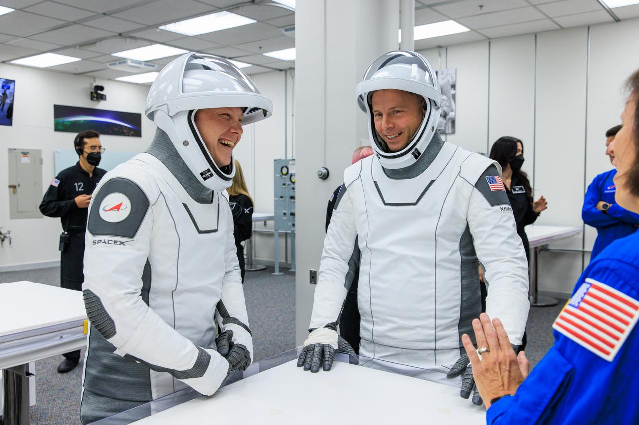 NASA astronaut Nick Hague (right) and Roscosmos cosmonaut Aleksandr Gorbunov play a traditional game of cards inside Astronaut Crew Quarters in the Neil A. Armstrong Operations and Checkout Building at the agency’s Kennedy Space Center in Florida ahead of launch of NASA’s SpaceX Crew-9 mission on Saturday, Sept. 28, 2024. Gorbunov and NASA astronaut Nick Hague will launch to the International Space Station aboard SpaceX’s Dragon spacecraft and Falcon 9 rocket. Launch is targeted for 1:17 p.m. EDT from Space Launch Complex-40 at Cape Canaveral Space Force Station in Florida. Crew-9 is the ninth crew rotation mission with SpaceX to the space station as part of the agency’s Commercial Crew Program.