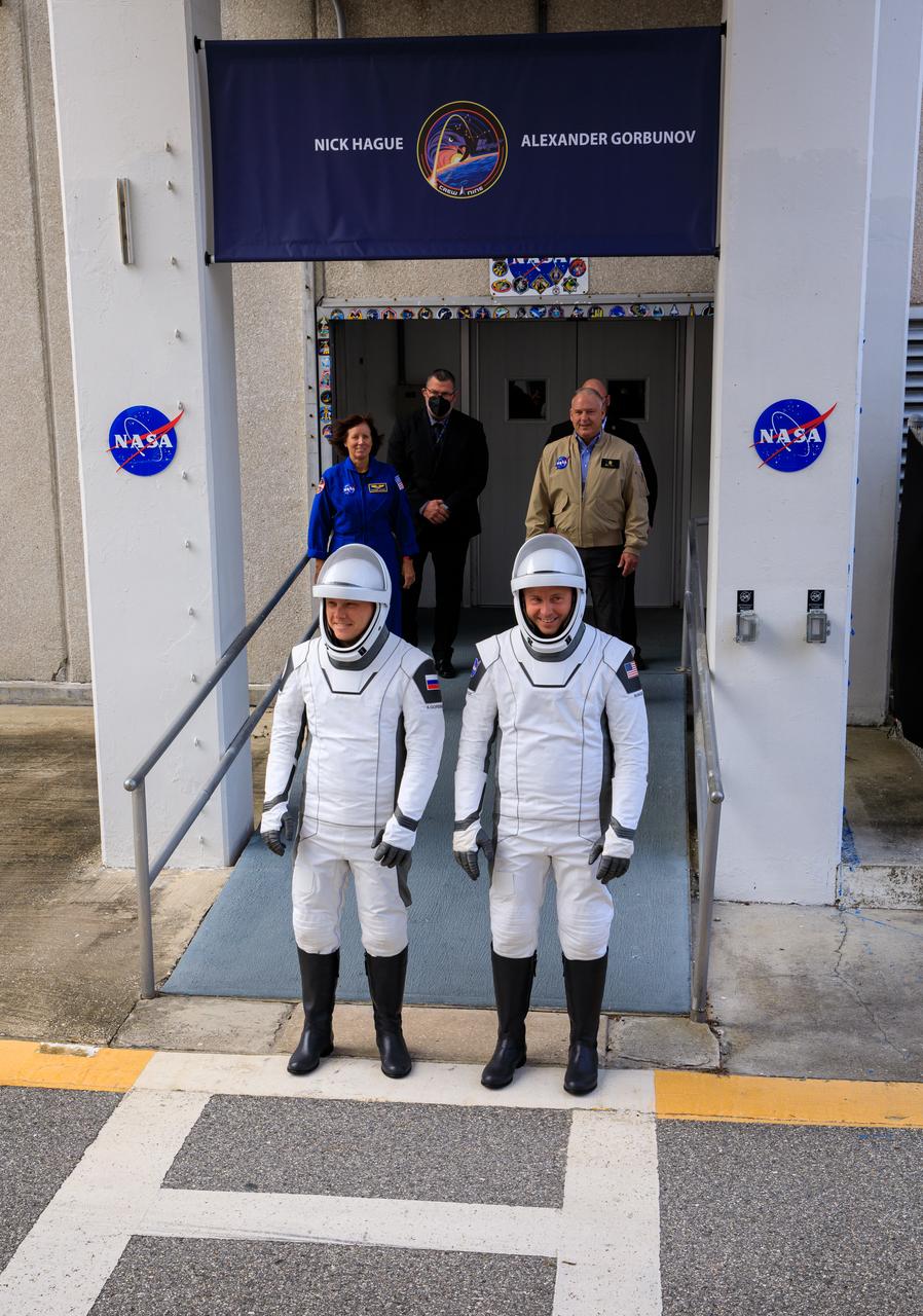 NASA’s SpaceX Crew-9 crew members walk out of the Neil A. Armstrong Operations and Checkout Building at the agency’s Kennedy Space Center in Florida ahead of launch on Saturday, Sept. 28, 2024. NASA astronaut Nick Hague (right) and Roscosmos cosmonaut Aleksandr Gorbunov will launch to the International Space Station aboard SpaceX’s Dragon spacecraft and Falcon 9 rocket. Launch is targeted for 1:17 p.m. EDT from Space Launch Complex-40 at Cape Canaveral Space Force Station in Florida. Crew-9 is the ninth crew rotation mission with SpaceX to the space station as part of the agency’s Commercial Crew Program.