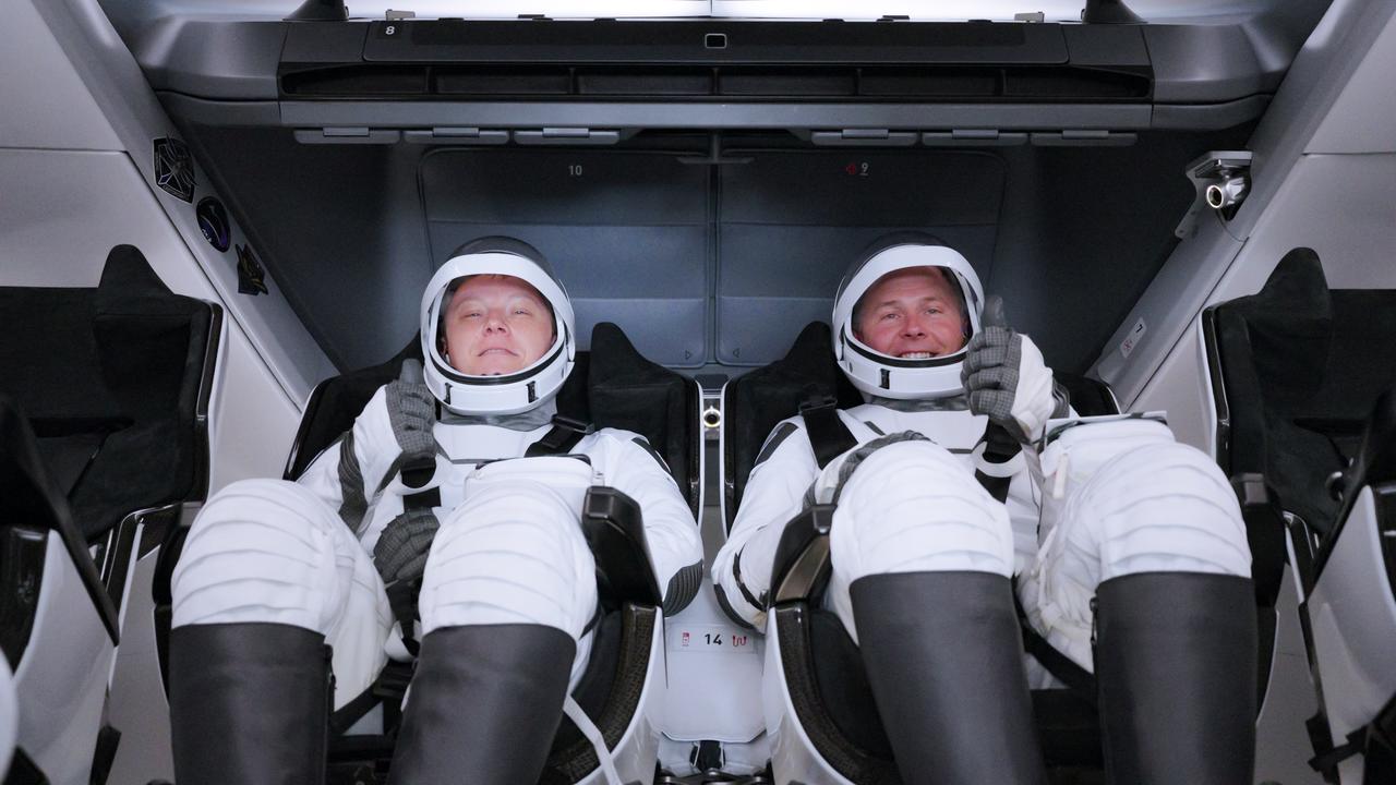 NASA’s SpaceX Crew-9 crew members Roscosmos cosmonaut Aleksandr Gorbunov (left) and NASA astronaut Nick Hague smile and wave inside a Dragon spacecraft at Space Launch Complex-40 at Cape Canaveral Space Force Station in Florida ahead of liftoff on Saturday; Sept. 28; 2024. Hague and Gorbunov will launch to the International Space Station aboard SpaceX’s Dragon spacecraft and Falcon 9 rocket. Launch is targeted for 1:17 p.m. EDT for the ninth crew rotation mission with SpaceX to the space station as part of the agency’s Commercial Crew Program.