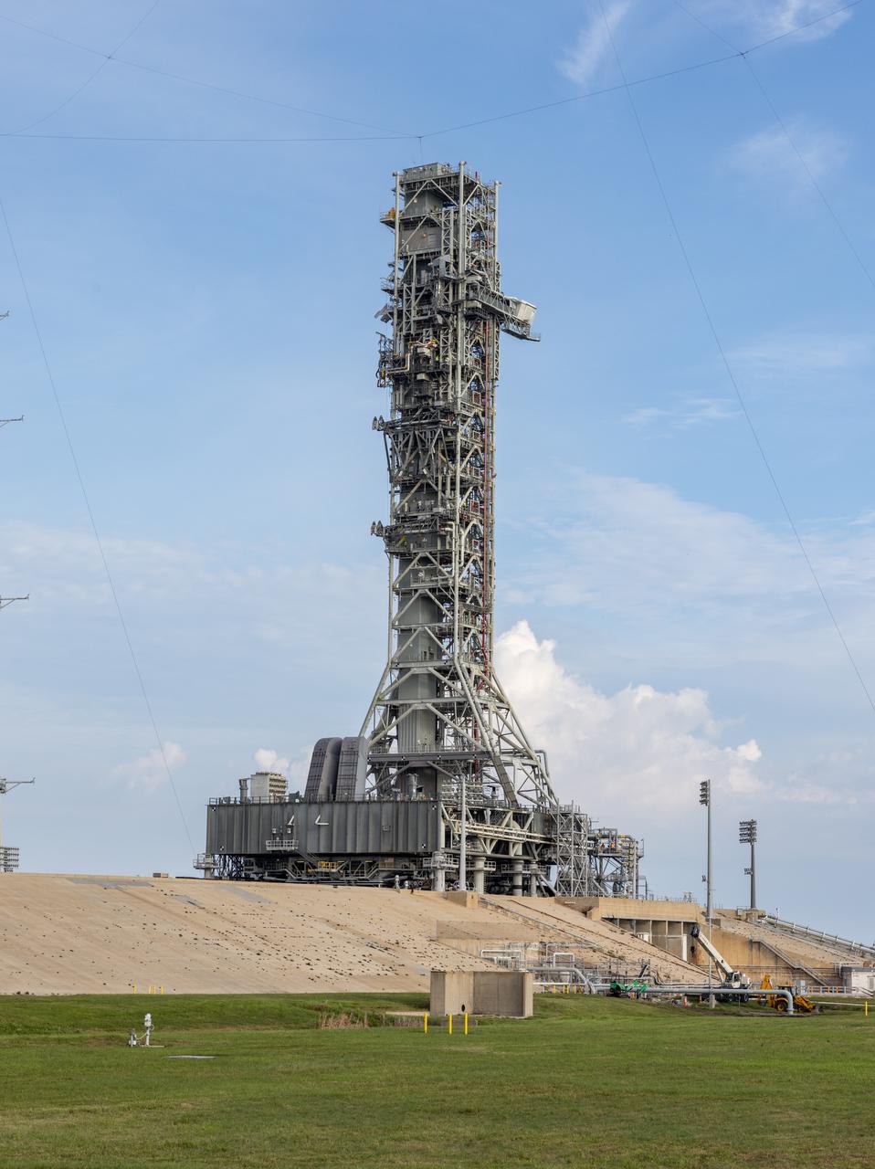 Teams with NASA’s Exploration Ground Systems Program at the agency’s Kennedy Space Center in Florida prepare to move mobile launcher 1 atop the agency’s crawler-transporter 2 from Launch Complex 39B to the Vehicle Assembly Building on Tuesday, Oct. 1, 2024. The crawler recently reached 2,500 miles traveling to the launch pad since its construction in 1965. The mobile launcher has been at the launch pad since August 2023 undergoing upgrades and tests in preparation for NASA’s Artemis II mission. The mobile launcher will be used to assemble, process, and launch NASA’s SLS (Space Launch System) and Orion spacecraft to the Moon and beyond. 
