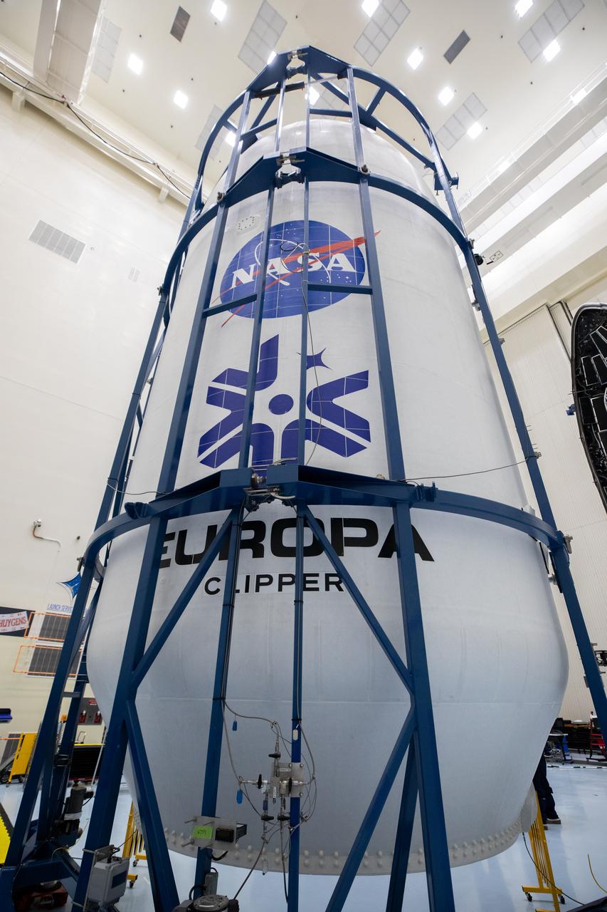 Technicians encapsulated NASA’s Europa Clipper spacecraft inside payload fairings on Wednesday, Oct. 2, 2024, in the Payload Hazardous Servicing Facility at NASA’s Kennedy Space Center in Florida. The fairings will protect the spacecraft during launch as it begins its journey to explore Jupiter’s icy moon, Europa. The mission will help scientists determine if the moon could support life. NASA and SpaceX are targeting launch at 12:31 p.m. EDT on Thursday, Oct. 10, 2024, from Launch Complex 39A at Kennedy Space Center in Florida.