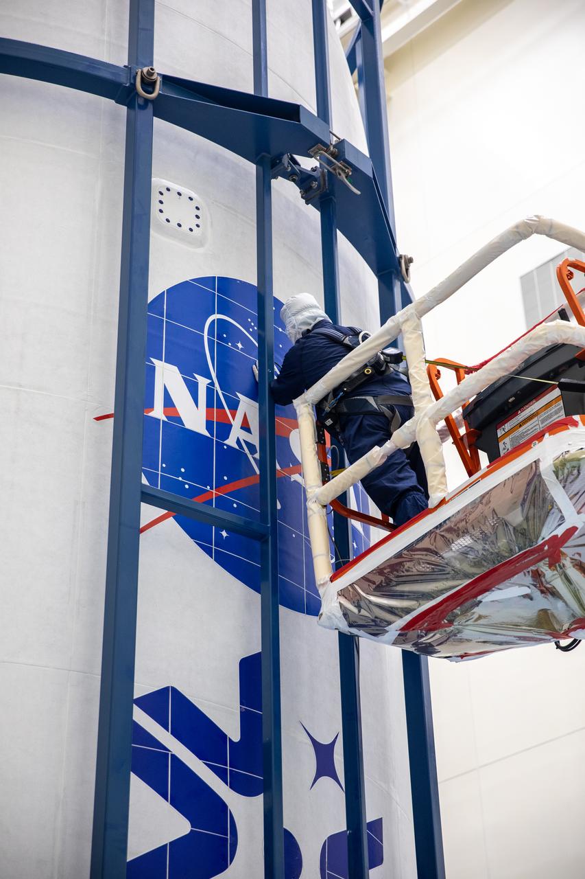Technicians encapsulated NASA’s Europa Clipper spacecraft inside payload fairings on Wednesday, Oct. 2, 2024, in the Payload Hazardous Servicing Facility at NASA’s Kennedy Space Center in Florida. The fairings will protect the spacecraft during launch as it begins its journey to explore Jupiter’s icy moon, Europa. The mission will help scientists determine if the moon could support life. NASA and SpaceX are targeting launch at 12:31 p.m. EDT on Thursday, Oct. 10, 2024, from Launch Complex 39A at Kennedy Space Center in Florida.