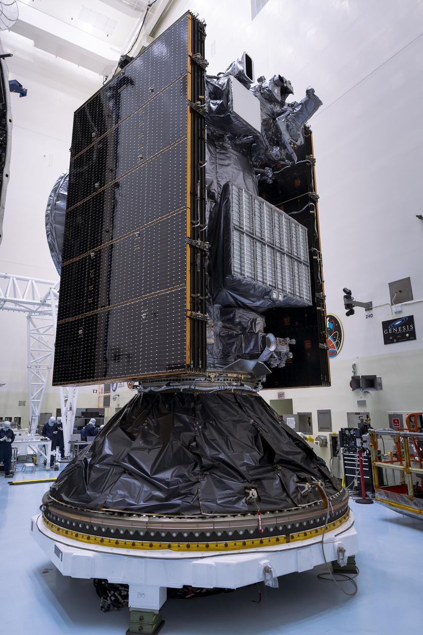 Technicians prepare to encapsulate NASA’s Europa Clipper spacecraft inside SpaceX’s Falcon Heavy payload fairing in the Payload Hazardous Servicing Facility at NASA’s Kennedy Space Center in Florida on Wednesday, Oct. 2, 2024. The payload fairing will protect the spacecraft during liftoff from Launch Complex 39A on its journey to explore Jupiter’s icy moon, Europa. The spacecraft will complete nearly 50 flybys of Jupiter’s icy moon, Europa, to determine if there are conditions suitable for life beyond Earth.