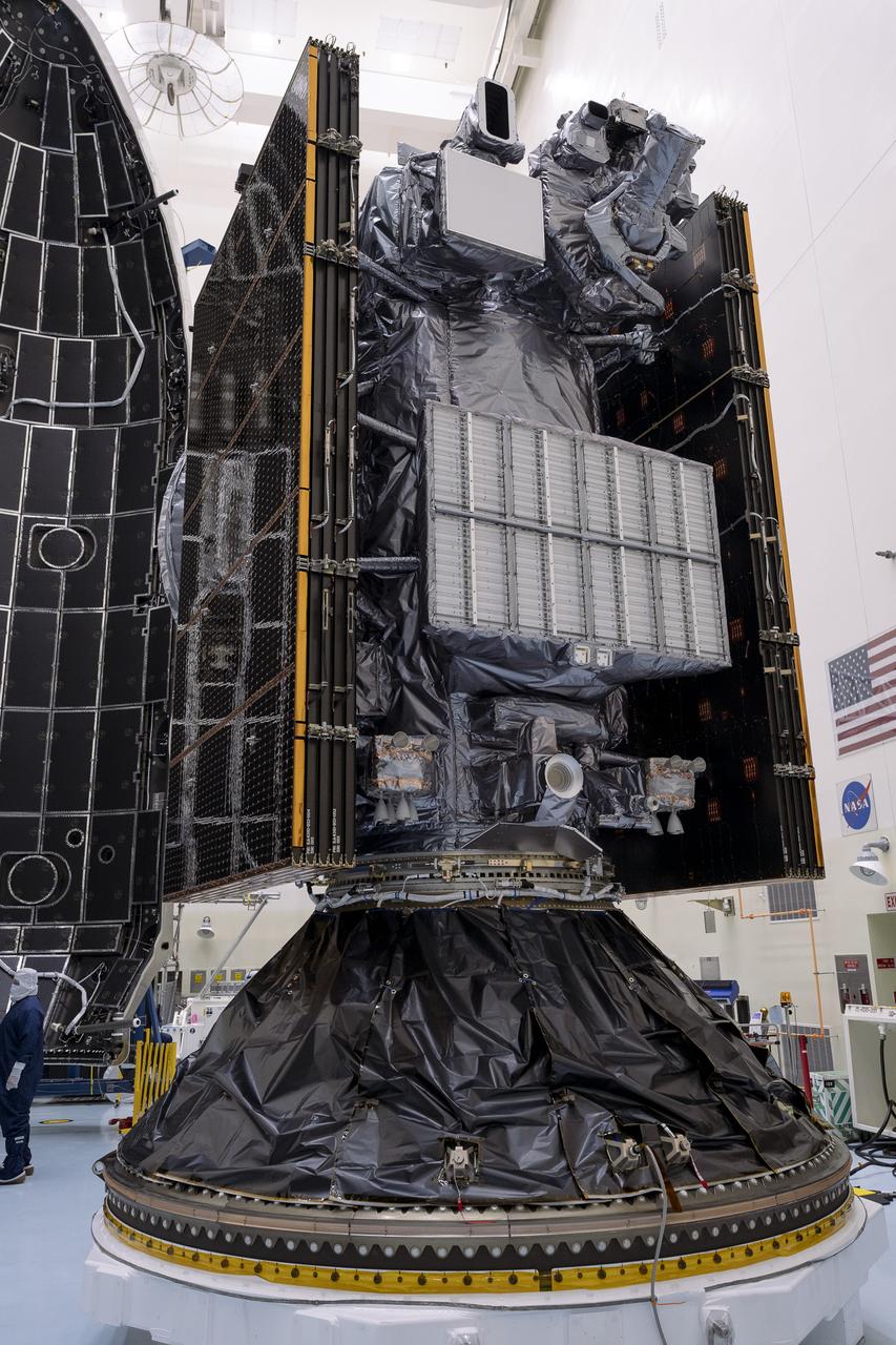 Technicians prepare to encapsulate NASA’s Europa Clipper spacecraft inside SpaceX’s Falcon Heavy payload fairing in the Payload Hazardous Servicing Facility at NASA’s Kennedy Space Center in Florida on Wednesday, Oct. 2, 2024. The payload fairing will protect the spacecraft during liftoff from Launch Complex 39A on its journey to explore Jupiter’s icy moon, Europa. The spacecraft will complete nearly 50 flybys of Jupiter’s icy moon, Europa, to determine if there are conditions suitable for life beyond Earth.
