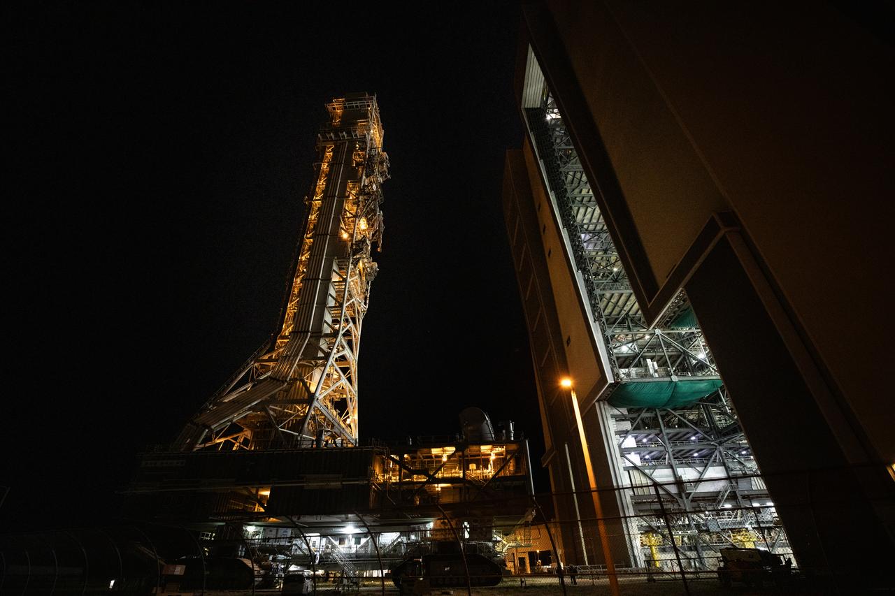 NASA’s mobile launcher 1 atop the spaceport’s crawler is transported inside the agency’s Vehicle Assembly Building at Kennedy Space Center in Florida ahead of integration of the Artemis II Moon rocket on Friday, Oct. 4, 2024. The mobile launcher has been at Launch Complex 39B since August 2023 undergoing upgrades and tests in preparation for NASA’s Artemis II mission. The mobile launcher will be used to assemble, process, and launch NASA’s SLS (Space Launch Systems) and Orion spacecraft to the Moon and beyond.