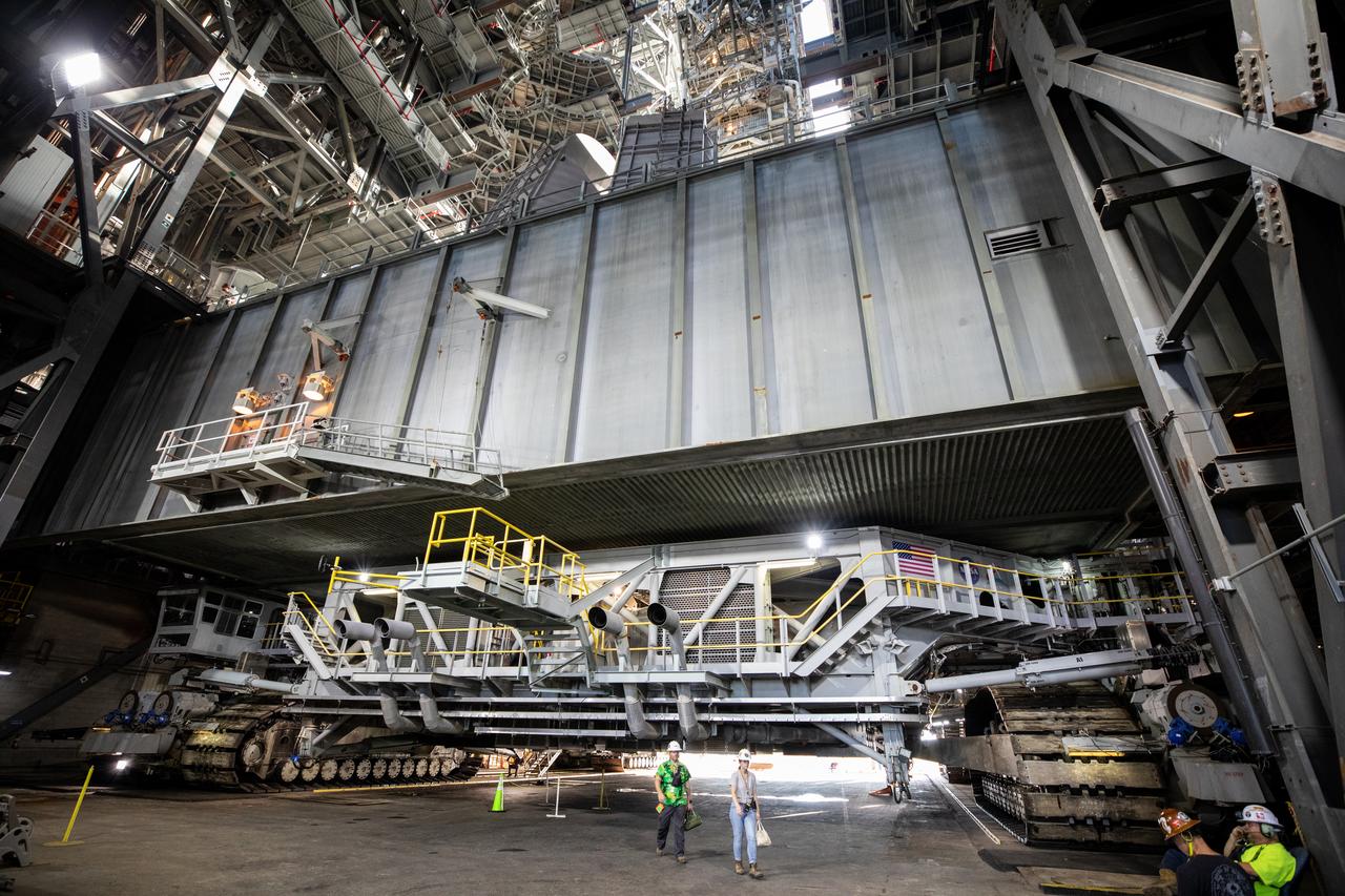 NASA’s mobile launcher 1 atop the spaceport’s crawler is transported inside the agency’s Vehicle Assembly Building at Kennedy Space Center in Florida ahead of integration of the Artemis II Moon rocket on Friday, Oct. 4, 2024. The mobile launcher will be used to assemble, process, and launch NASA’s SLS (Space Launch Systems) and Orion spacecraft to the Moon and beyond.