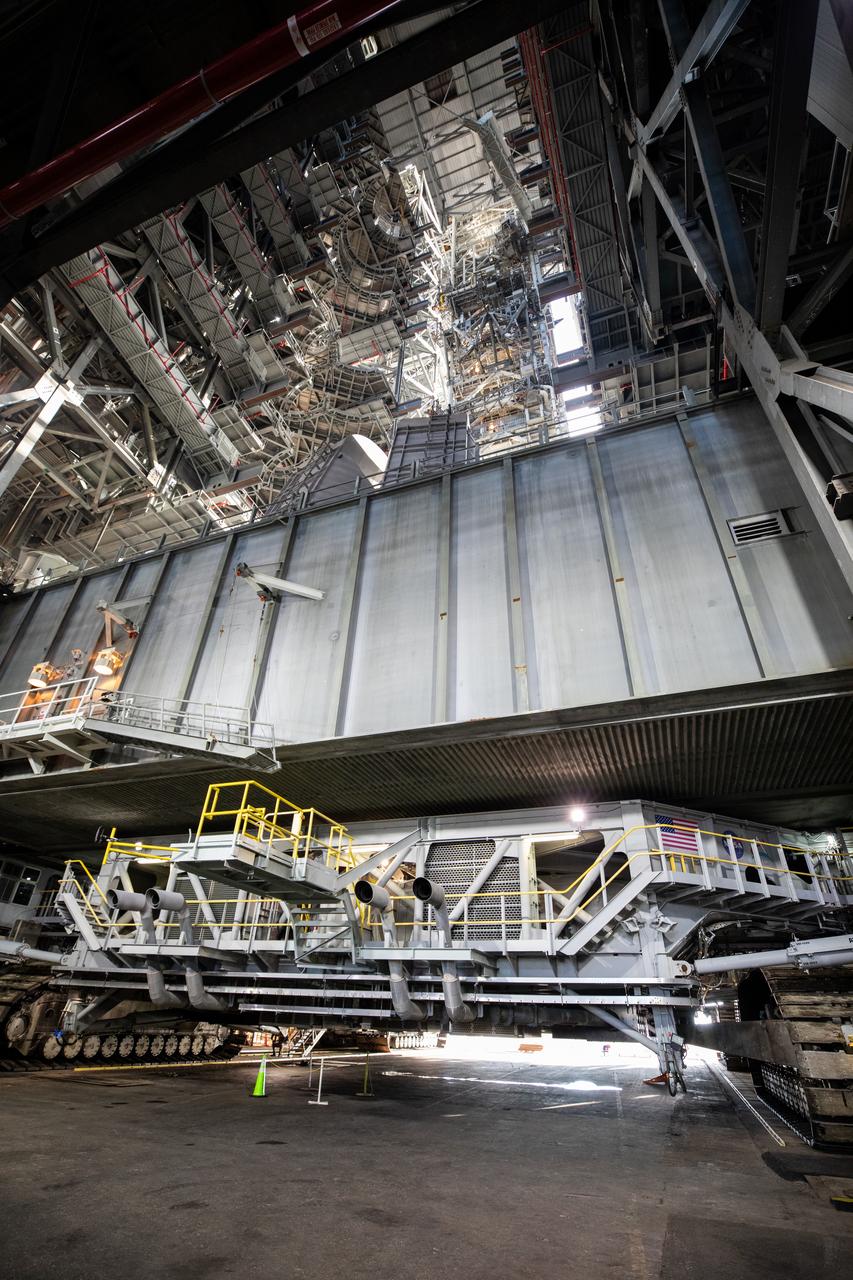 NASA’s mobile launcher 1 atop the spaceport’s crawler is transported inside the agency’s Vehicle Assembly Building at Kennedy Space Center in Florida ahead of integration of the Artemis II Moon rocket on Friday, Oct. 4, 2024. The mobile launcher will be used to assemble, process, and launch NASA’s SLS (Space Launch Systems) and Orion spacecraft to the Moon and beyond.