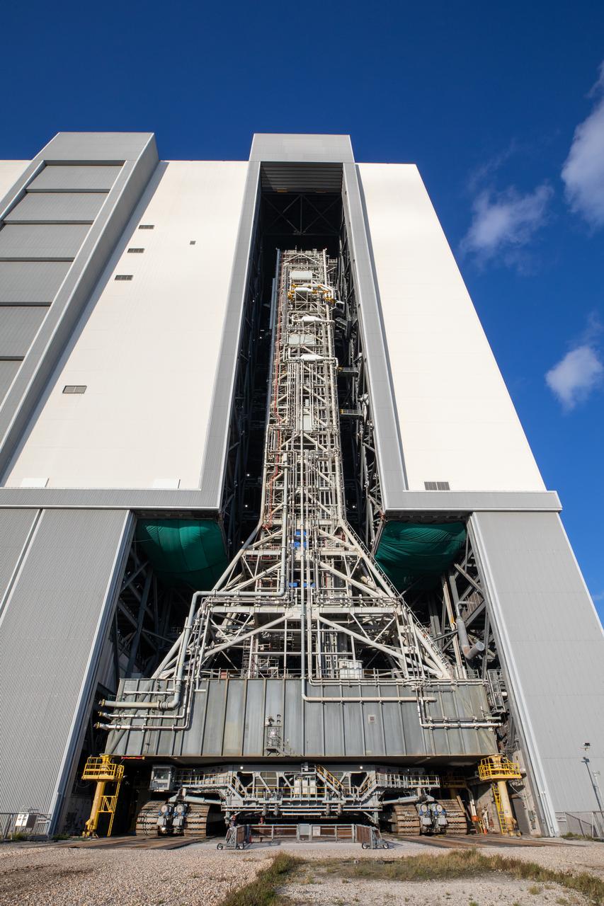 NASA’s mobile launcher 1 atop the spaceport’s crawler is transported inside the agency’s Vehicle Assembly Building at Kennedy Space Center in Florida ahead of integration of the Artemis II Moon rocket on Friday, Oct. 4, 2024. The mobile launcher will be used to assemble, process, and launch NASA’s SLS (Space Launch Systems) and Orion spacecraft to the Moon and beyond.