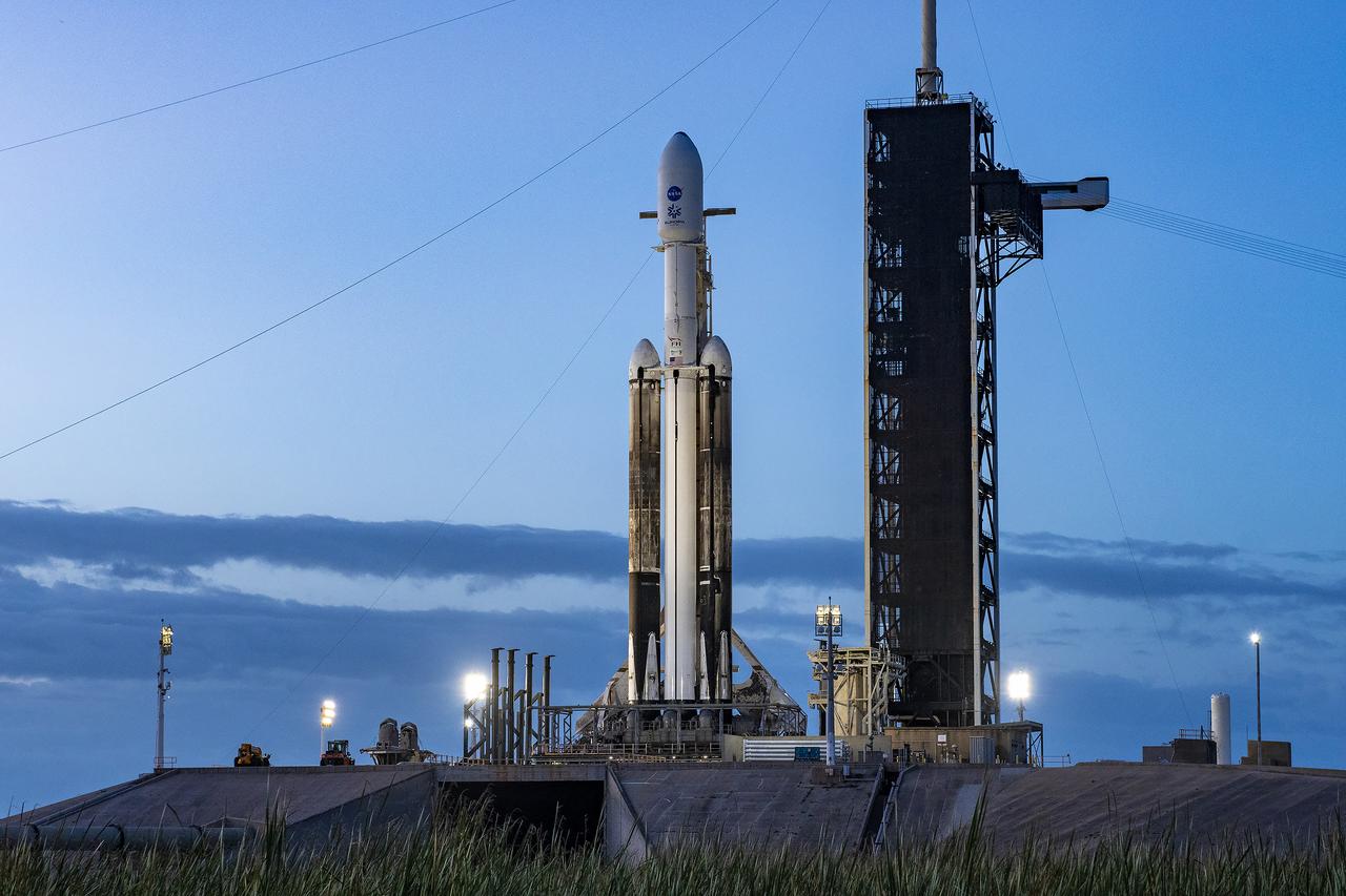 NASA’s Europa Clipper spacecraft and SpaceX’s Falcon Heavy rocket stands at Launch Pad 39A on Sunday, Oct. 13, 2024, at the agency’s Kennedy Space Center in Florida ahead of launch to Jupiter’s icy moon, Europa. The spacecraft will complete nearly 50 flybys of Europa to determine if there are conditions suitable for life beyond Earth. NASA and SpaceX are targeting launch for Europa Clipper at 12:06 p.m. EDT on Monday, Oct. 14, from Launch Complex 39A at Kennedy Space Center in Florida.