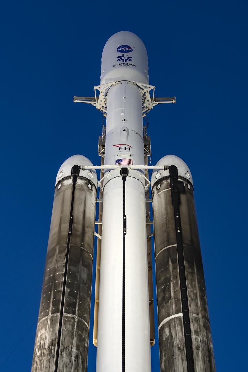 NASA’s Europa Clipper spacecraft and SpaceX’s Falcon Heavy rocket are vertical at Launch Pad 39A on Sunday, Oct. 13, 2024, at the agency’s Kennedy Space Center in Florida ahead of launch to Jupiter’s icy moon, Europa. The spacecraft will complete nearly 50 flybys of Europa to determine if there are conditions suitable for life beyond Earth. Launch is targeting 12:06 p.m. EDT on Monday, Oct. 14, from Launch Complex 39A at Kennedy Space Center in Florida.