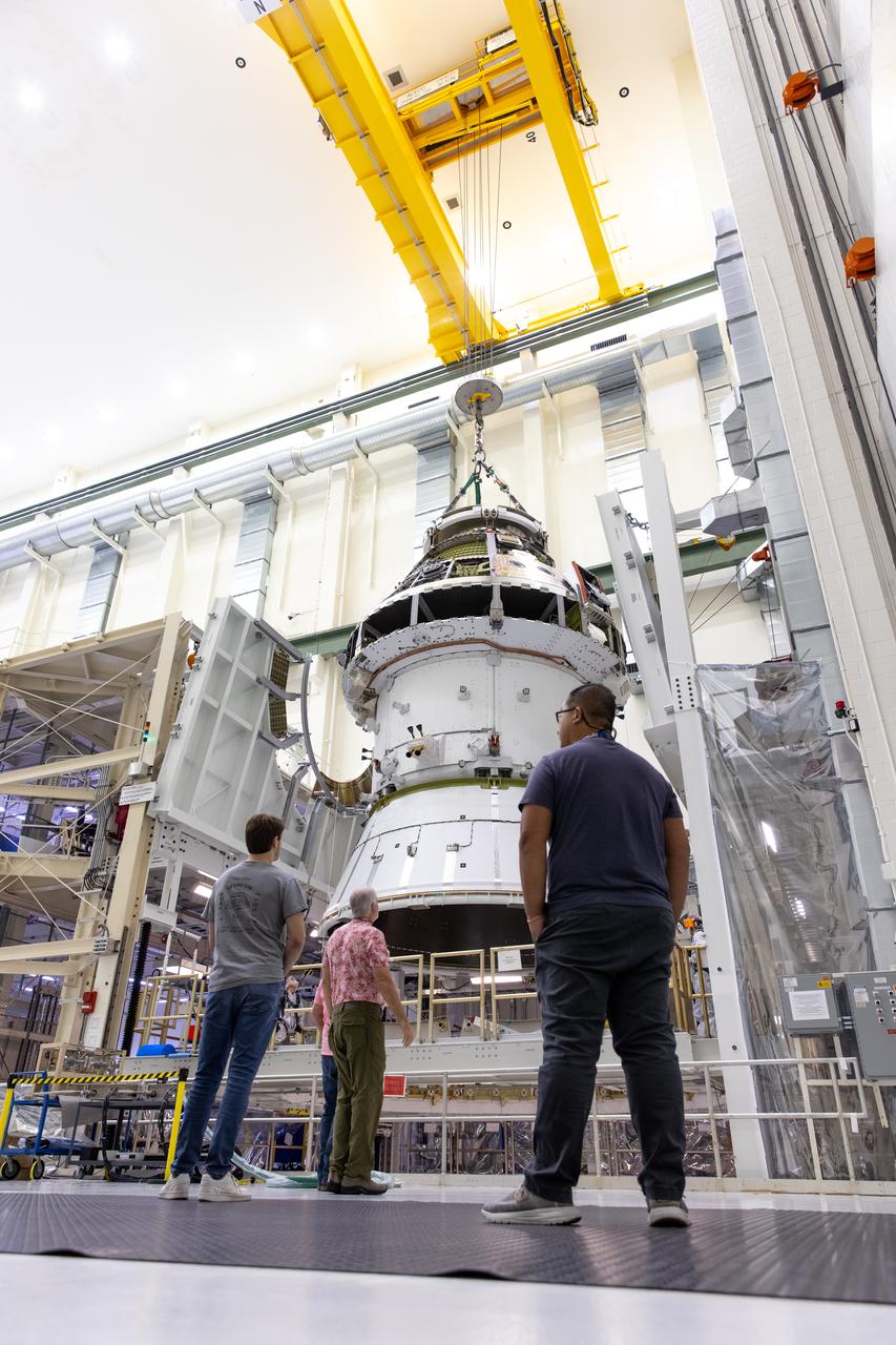 A massive crane lifts NASA’s Orion spacecraft out of the Final Assembly and System Testing cell and moves it to the altitude chamber to complete further testing on Thursday, Nov. 7, 2024, inside the Neil A. Armstrong Operations and Checkout building at NASA's Kennedy Space Center in Florida. The altitude chamber simulates deep space vacuum conditions, and the testing will provide additional data to augment data gained during testing earlier this summer. The Orion spacecraft will carry NASA astronauts Victor Glover, Christina Koch, and Reid Wiseman, as well as CSA (Canadian Space Agency) astronaut Jeremy Hansen, on a 10-day journey around the Moon and back for the Artemis II test flight.