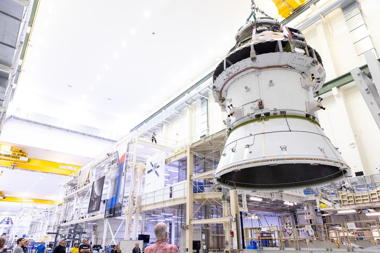 A massive crane lifts NASA’s Orion spacecraft out of the Final Assembly and System Testing cell and moves it to the altitude chamber to complete further testing on Thursday, Nov. 7, 2024, inside the Neil A. Armstrong Operations and Checkout building at NASA's Kennedy Space Center in Florida. The altitude chamber simulates deep space vacuum conditions, and the testing will provide additional data to augment data gained during testing earlier this summer. The Orion spacecraft will carry NASA astronauts Victor Glover, Christina Koch, and Reid Wiseman, as well as CSA (Canadian Space Agency) astronaut Jeremy Hansen, on a 10-day journey around the Moon and back for the Artemis II test flight.