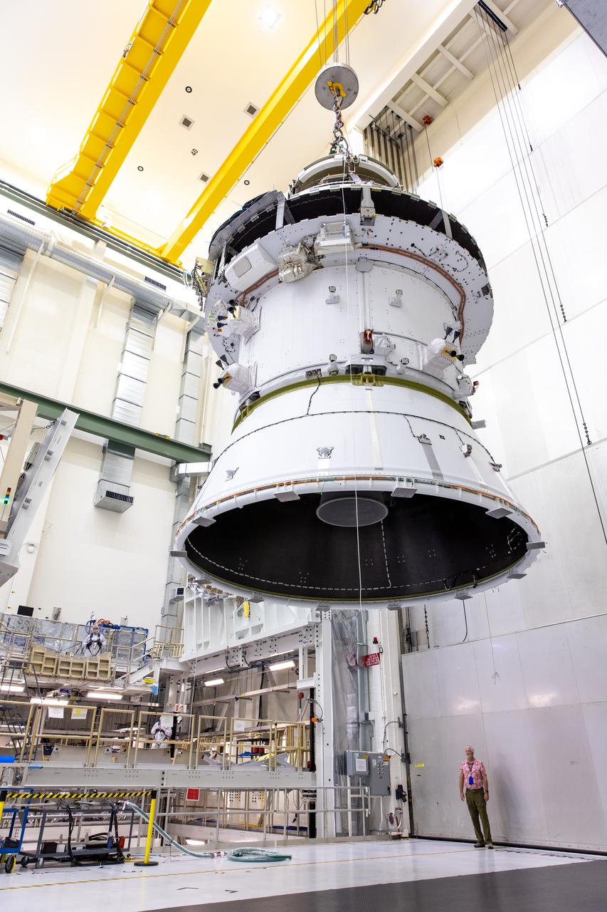 A massive crane lifts NASA’s Orion spacecraft out of the Final Assembly and System Testing cell and moves it to the altitude chamber to complete further testing on Thursday, Nov. 7, 2024, inside the Neil A. Armstrong Operations and Checkout building at NASA's Kennedy Space Center in Florida. The altitude chamber simulates deep space vacuum conditions, and the testing will provide additional data to augment data gained during testing earlier this summer. The Orion spacecraft will carry NASA astronauts Victor Glover, Christina Koch, and Reid Wiseman, as well as CSA (Canadian Space Agency) astronaut Jeremy Hansen, on a 10-day journey around the Moon and back for the Artemis II test flight.