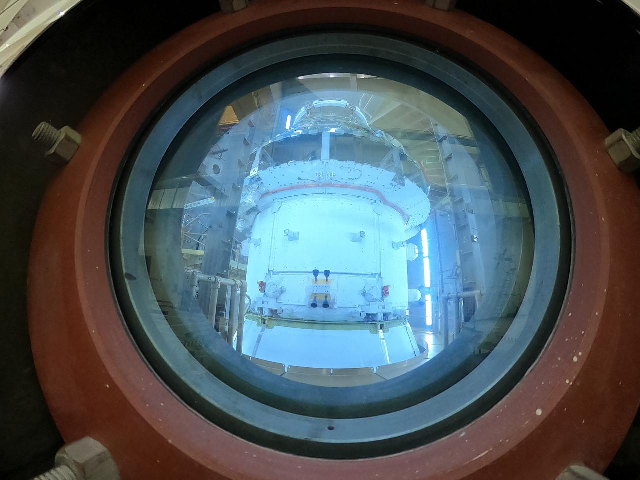 Technicians capture a photo of NASA’s Orion spacecraft inside the altitude chamber to complete further testing on Friday, Nov. 8, 2024, inside the Neil A. Armstrong Operations and Checkout building at NASA's Kennedy Space Center in Florida. The altitude chamber simulates deep space vacuum conditions, and the testing will provide additional data to augment data gained during testing earlier this summer. The Orion spacecraft will carry NASA astronauts Victor Glover, Christina Koch, and Reid Wiseman, as well as CSA (Canadian Space Agency) astronaut Jeremy Hansen, on a 10-day journey around the Moon and back for the Artemis II test flight.