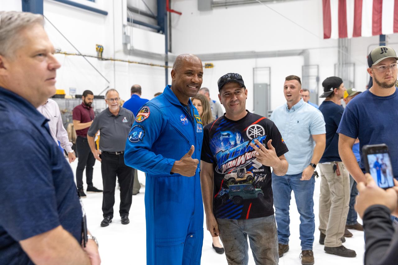 NASA astronaut Victor Glover takes photos during a visit on Friday, Nov. 8, 2024, with employees at JP Donovan Construction in Rockledge, Florida. JP Donovan Construction is one of the contractors working with the agency’s Exploration Ground Systems Program to help NASA send astronauts, including Glover, to the Moon and back through the Artemis II launch. 