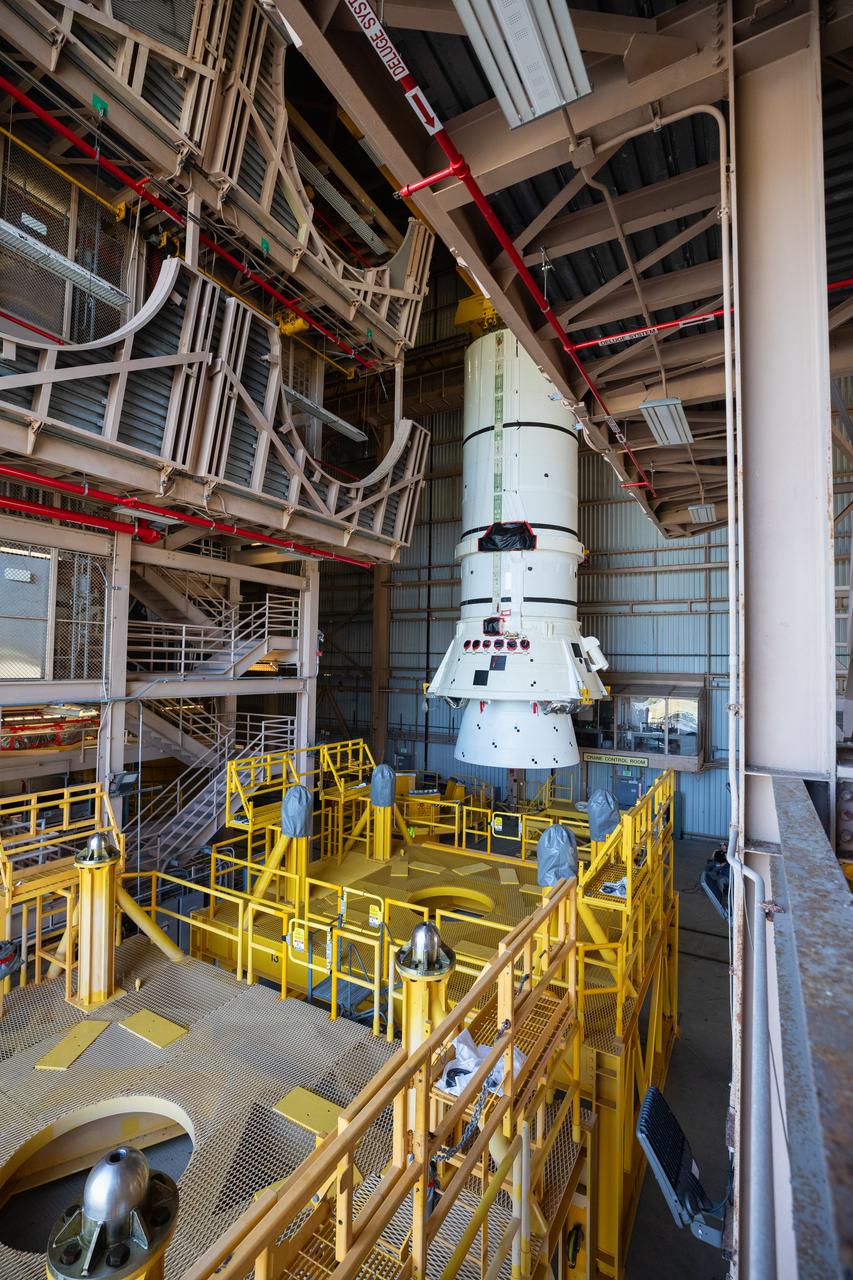Engineers and technicians with the Exploration Ground Systems Program prepare to transfer one of the aft assemblies of the SLS (Space Launch System) solid rocket boosters for the Artemis II mission with an overhead crane inside the Rotation, Processing and Surge Facility at NASA’s Kennedy Space Center in Florida on Wednesday, Nov. 13, 2024. The booster segments are being transferred to the NASA Kennedy’s Vehicle Assembly Building via a transporter for stacking operations in preparation for launch of the Artemis II mission.