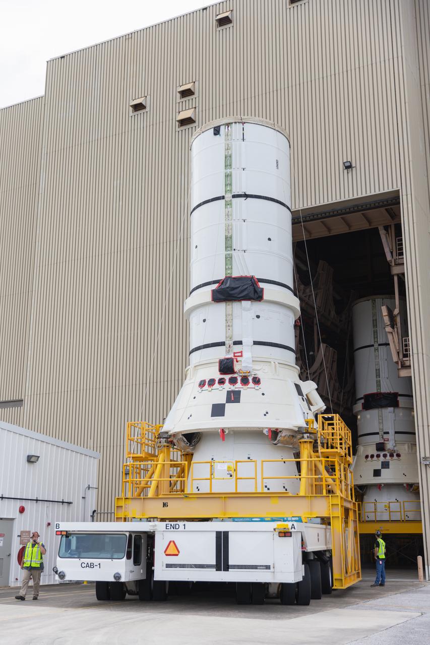 The left aft assembly of the SLS (Space Launch System) solid rocket boosters for the Artemis II mission is moved from the Rotation, Processing and Surge Facility to the Vehicle Assembly Building at NASA’s Kennedy Space Center in Florida on Monday, Nov. 18, 2024. The aft assembly will be lifted atop the mobile launcher, followed by the right aft assembly and remaining booster segments. 