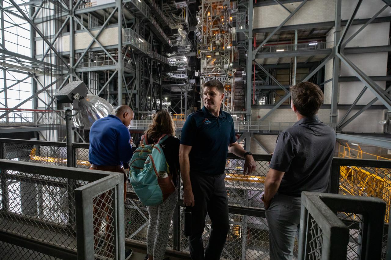 The Artemis II crew, NASA astronauts Victor Glover, left, and Christina Koch, Canadian Space Agency (CSA) astronaut Jeremy Hansen, and Reid Wiseman, right, view operations on Tuesday, Nov. 19, 2024, inside the Vehicle Assembly Building at NASA's Kennedy Space Center in Florida.