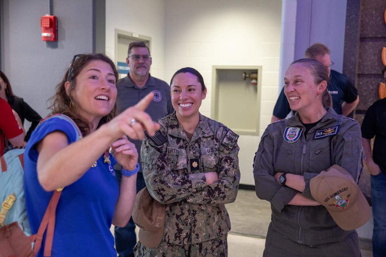 NASA astronaut Christina Koch speaks with members of the agency’s Artemis II Landing and Recovery team and partners from the Department of Defense on Tuesday, Nov. 19, 2024, inside the Vehicle Assembly Building at NASA's Kennedy Space Center in Florida, during a visit by the Artemis II crew to the facility. 
