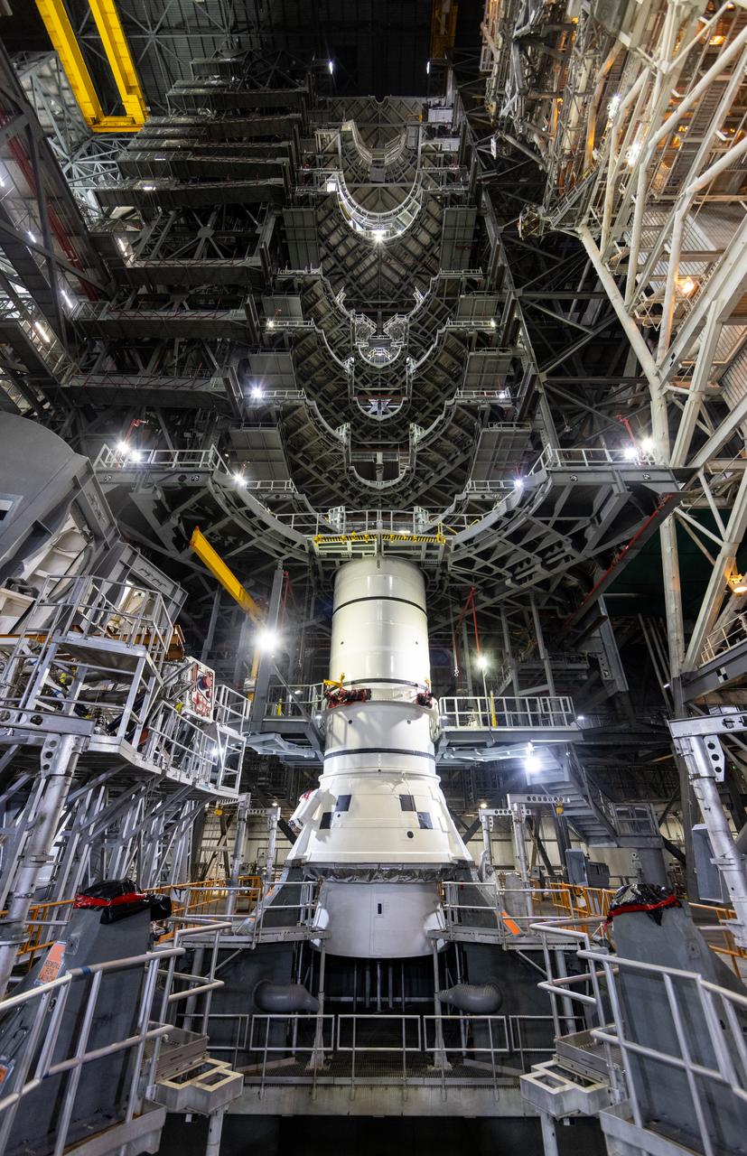 Engineers and technicians with the Exploration Ground Systems Program stack the first Moon rocket segment – the left aft assembly for the Artemis II SLS (Space Launch System) solid rocket booster onto mobile launcher 1 inside the Vehicle Assembly Building at NASA’s Kennedy Space Center on Wednesday, Nov. 20, 2024. The first of 10 booster segments to be stacked, the boosters will help support the remaining rocket components and the Orion spacecraft during final assembly of the Artemis II Moon rocket and provide more than 75 percent of the total SLS thrust during liftoff from NASA Kennedy’s Launch Pad 39B.