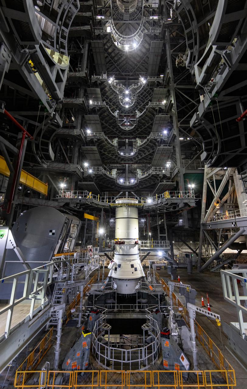 Engineers and technicians with the Exploration Ground Systems Program stack the first Moon rocket segment – the left aft assembly for the Artemis II SLS (Space Launch System) solid rocket booster onto mobile launcher 1 inside the Vehicle Assembly Building at NASA’s Kennedy Space Center on Wednesday, Nov. 20, 2024. The first of 10 booster segments to be stacked, the boosters will help support the remaining rocket components and the Orion spacecraft during final assembly of the Artemis II Moon rocket and provide more than 75 percent of the total SLS thrust during liftoff from NASA Kennedy’s Launch Pad 39B.