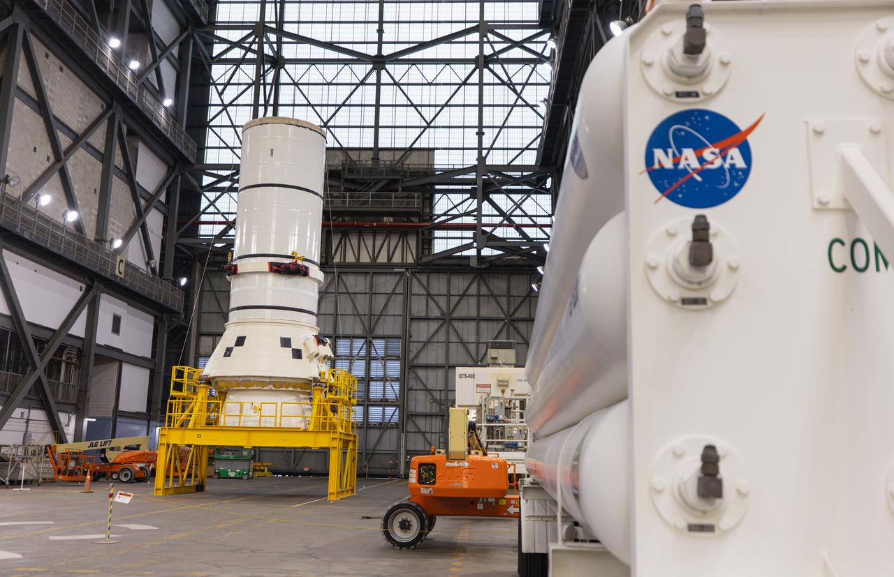 Engineers and technicians with NASA’s Exploration Ground Systems Program move the right aft assembly, or bottom portion of the right solid rocket booster for the agency’s SLS (Space Launch System) rocket, into the transfer aisle of the Vehicle Assembly Building at NASA’s Kennedy Space Center in Florida on Thursday, Nov. 22, 2024. The right aft assembly will be lifted atop mobile launcher 1, joining the previously stacked left aft assembly as the first booster segments stacked for the Artemis II Moon rocket. 