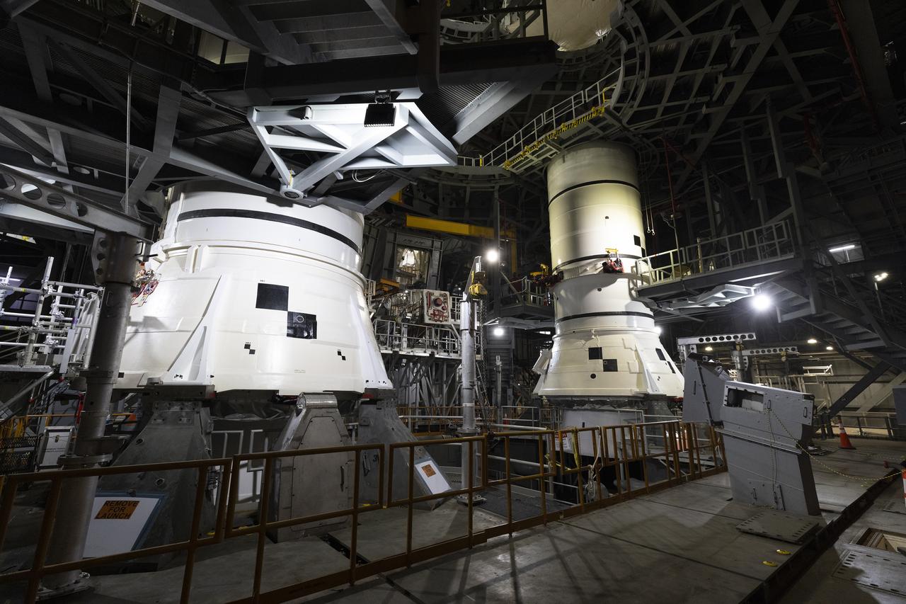 Engineers and technicians with NASA’s Exploration Ground Systems Program complete stacking of the first Moon rocket segments – the left and right aft assemblies for the agency’s Artemis II SLS (Space Launch System) solid rocket boosters – onto mobile launcher 1 inside the Vehicle Assembly Building at Kennedy Space Center on Friday, Nov. 22, 2024. The first two of 10 booster segments to be stacked, the boosters will help support the remaining rocket components and the Orion spacecraft during final assembly of the Artemis II Moon rocket and provide more than 75 percent of the total SLS thrust during liftoff from NASA Kennedy’s Launch Pad 39B.