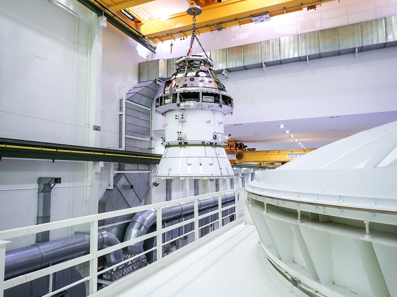 On Thursday, Dec. 5, 2024, a team returns the Artemis II Orion spacecraft to the Final Assembly and Test cell from a vacuum chamber inside the Neil A. Armstrong Operations and Checkout Building at NASA's Kennedy Space Center in Florida where it underwent vacuum testing.