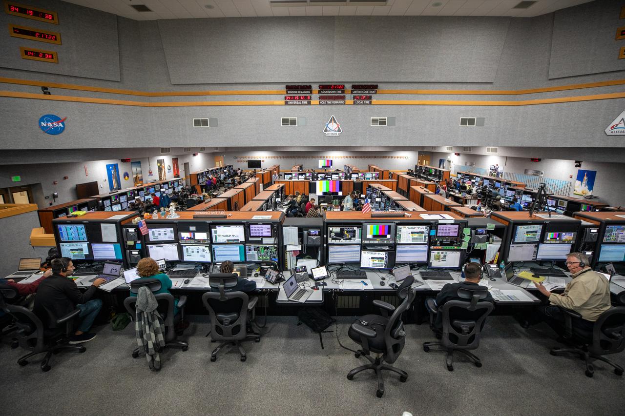Members of the Artemis launch team participate in an Artemis II Terminal Count Simulation in Firing Room 1 inside the Launch Control Center at NASA’s Kennedy Space Center in Florida on Friday, Dec. 6, 2024. Teams practiced running through the last hours of launch countdown as part of an integrated ground systems test the Exploration Ground Systems team is undergoing to prepare for Artemis II. This particular operation focused on testing the updated launch control system software the Artemis launch team uses to launch the SLS (Space Launch System) rocket and Orion spacecraft. Four astronauts will venture around the Moon on Artemis II, the first crewed mission on NASA’s path to establishing a long-term presence for science and exploration through Artemis.
