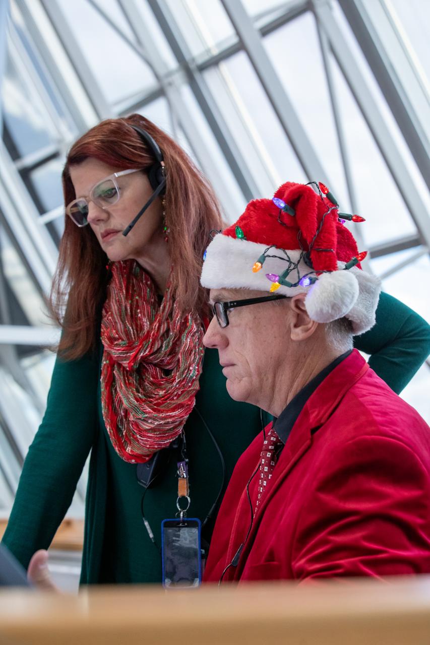 Charlie Blackwell-Thompson, at left, NASA Artemis launch director; and Jeremy Graeber, assistant Artemis launch director, monitor the terminal countdown simulation for the Artemis II mission inside Firing Room at the Launch Control Center at NASA’s Kennedy Space Center in Florida on Thursday, Dec. 12, 2024. Four astronauts will venture around the Moon on Artemis II, the first crewed mission on NASA’s path to establishing a long-term presence for science and exploration through Artemis.