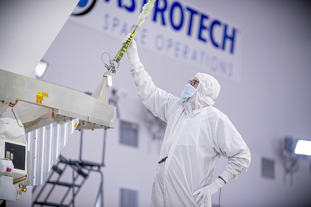 Employees with BAE Systems conduct spacecraft processing of NASA’s SPHEREx (Spectro-Photometer for the History of the Universe, Epoch of Reionization and Ices Explorer) observatory inside the Astrotech Space Operations Facility at Vandenberg Space Force Base in California on Thursday, Jan. 16, 2025. BAE Systems (formerly Ball Aerospace) built the telescope and the spacecraft bus. SPHEREx will use its telescope to provide an all-sky spectral survey, creating a 3D map of the entire sky to help scientists investigate the origins of our universe. Riding along with SPHEREx, NASA’s PUNCH (Polarimeter to Unify the Corona and Heliosphere) mission will study origins of the Sun’s outflow of material, or the solar wind. Liftoff aboard a SpaceX Falcon 9 rocket is targeted for 10:09 p.m. EST (7:09 p.m. PST), Thursday, Feb. 27, 2025, from Space Launch Complex 4 East.