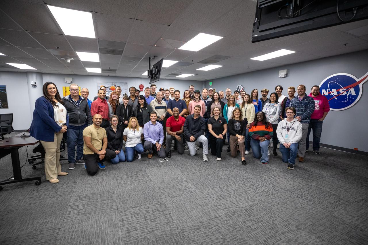 Members and backup members of the Artemis II team pose for a photo with NASA’s Exploration Ground Systems team during a visit to Kennedy Space Center in Florida on Thursday, Jan. 16, 2025. For Artemis II, four astronauts will venture around the Moon, the first crewed mission on NASA’s path to establishing a long-term presence for science and exploration through Artemis.