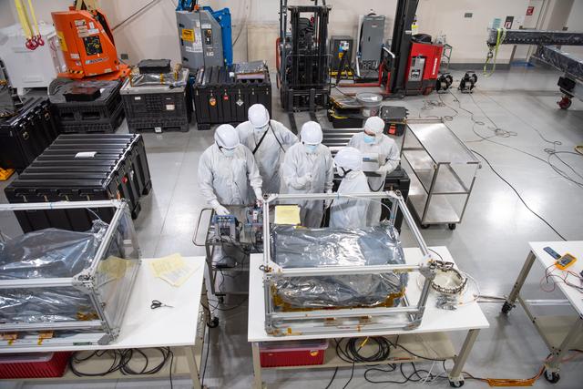 NASA image: PUNCH Satellites Lift to Work Stand fo Testing Operations