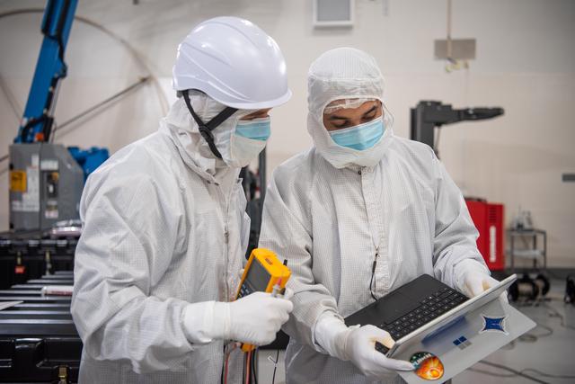 NASA image: PUNCH Satellites Lift to Work Stand fo Testing Operations