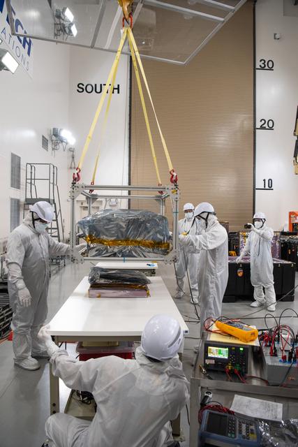 NASA image: PUNCH Satellites Lift to Work Stand fo Testing Operations